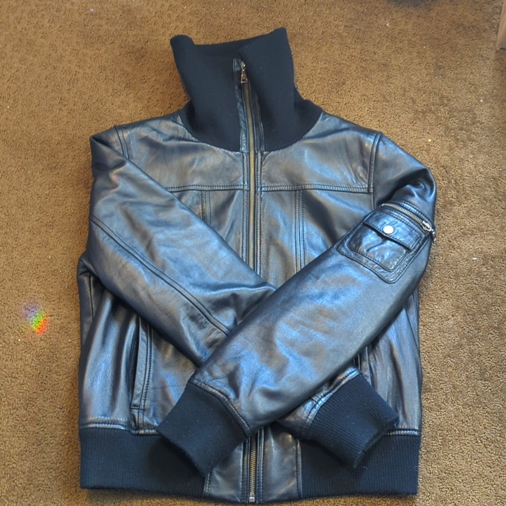 Leather jacket with knit detail